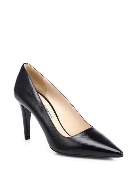 Saffiano patent leather pumps in black .